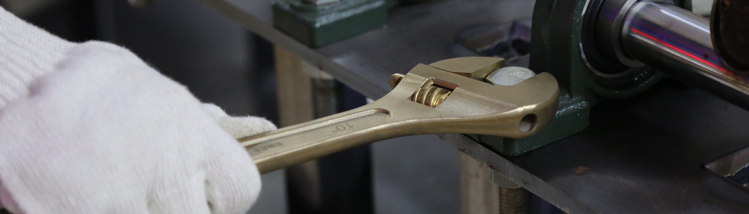 Non-sparking adjustable wrench for hazardous industrial maintenance